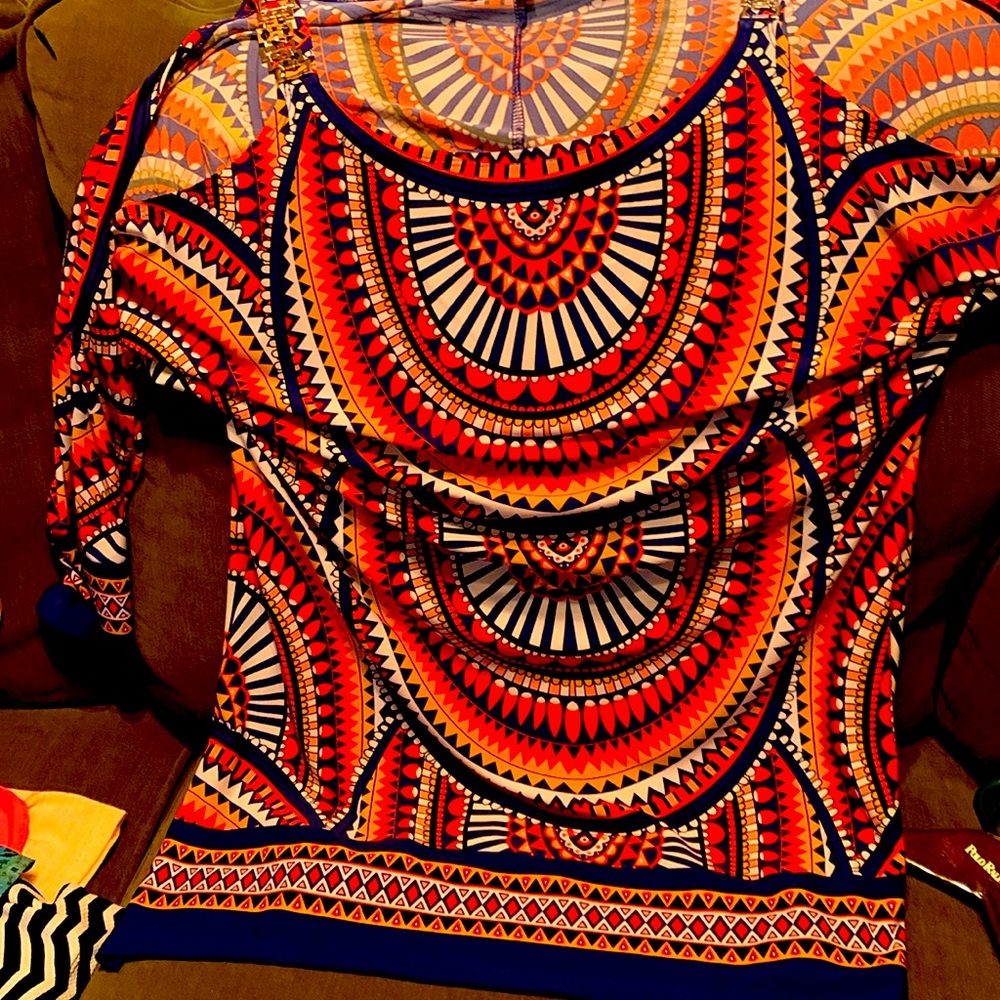 A beautiful multi color long top with cold shoulder